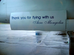 Despite the torrential downpour, our Aero Mongolia flight takes off on time