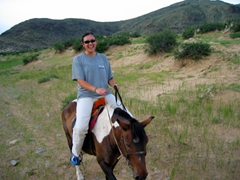 Frances is all giggles at the end of her horse ride through the Hogno Khan mountain range