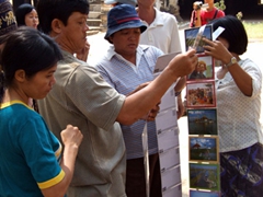 Selecting postcards from a Yoke-son souvenir vendor