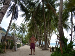 Robby walking down Boracay's main sandy strip where flip flops are optional