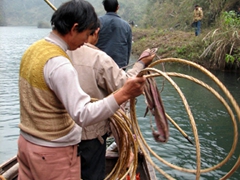 Our trackers get ready to hop to shore to pull us with vine strings alongside the riverbank