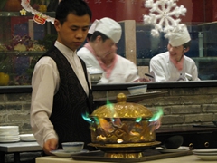 Our waiter prepares one of many dumpling dishes for us to try; Tang Dynasty Restaurant