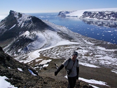 Robby climbing up to the peak of Devil Island, with a fantastic panorama all around