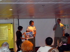Patrick and Hugh offering one of Hugh's favorite photos for sale at the "Save the Albatross" fundraiser, hosted by Craig Poore