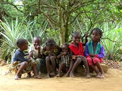 Portrait of a group of well behaved children in Nyanga (our truck broke down in front of their house and we sought refuge from the scorching sun in their front yard under a shady tree); Congo