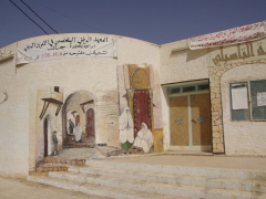 Popular Casbah image painted on the side of a building in Djanet

