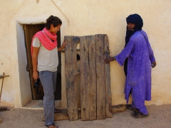 Becky and Abdallah checking out the original (and ancient) cyprus door of ksar El Mihane
