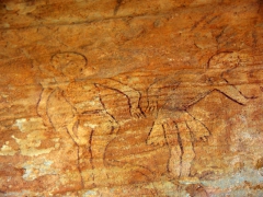 Giant, round headed figures on a cave wall; Jabbaren
