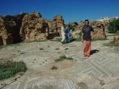 Becky standing on mozaics of a Roman bath house; Cherchell
