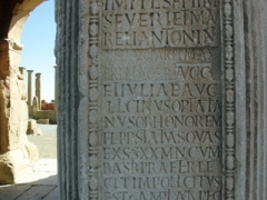 Marble tablet in front of Trajan's Arch; Timgad
