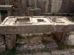 The Romans were very advanced for their time as they developed a unique weights and measures system with this table (grain would be measured and poured in from the top openings and gathered in a bag below); Market of Cosinius
