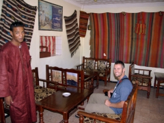 Salim and Robby wait for the Timgad site to be opened at a neighboring cafe
