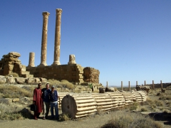 Salim, Robby, and Hamid posing by the base of one of the columns from the Temple of Jupiter; Timgad

