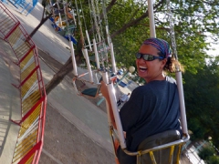 Becky laughs as the ride gets progressively more dangerous at the Setif amusement park (you can easily hit the nearby trees with your outstretched legs or arms if not careful and the ride feels like it goes on forever!)
