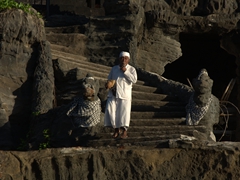 A worshipper makes his way down from Tanah Lot Temple