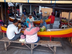 Locals enjoying a seafood dinner at Jimbaran fish market