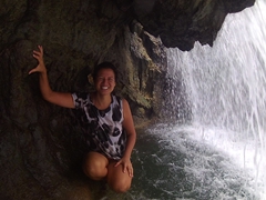 Becky climbs behind this waterfall and pauses for a breather...what a stunning location!