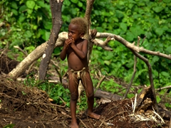 Young boy wearing nothing but a namba (penis sheath)