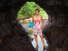 Becky exploring a lava tunnel; To Sua Ocean Trench