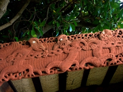 Detailed carving on a Maori food preserve