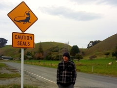 Robby next to a sign cautioning us about the seals of Kaikoura