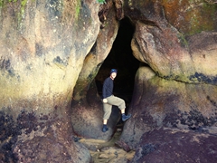 Robby checking out the interesting caves of Split Apple Rock beach