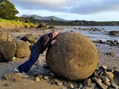 Robby pushing a massive spherical boulder; Koutu Boulders