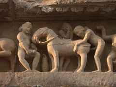 An example of bestiality while a woman in the background covers her eyes; Lakshmana Temple