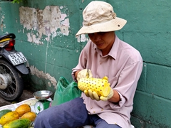 Fresh pineapple for sale (and the seller will cut it for you), for about 40 cents
