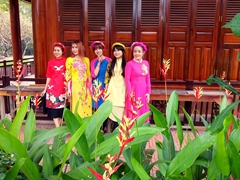 Ladies show off their pretty "áo dài" (traditional dress); Buu Long Pagoda