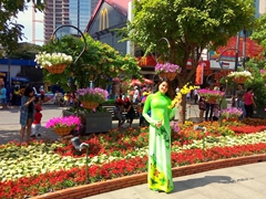 A pretty lady strikes a pose; Nguyễn Huệ Flower Street