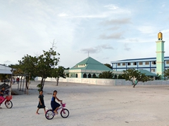Young girls playing by the mosque; Dhiggaru Island