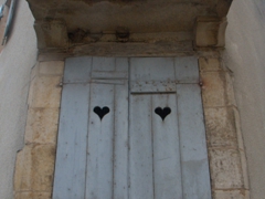 Heart carved windows in Châtel-Censoir
