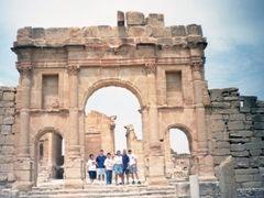 Standing beneath the Gate of Antoninus, entrance to the Sbeitla Forum