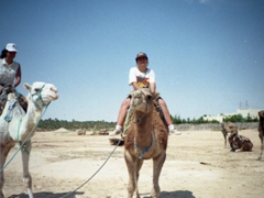 Becky and Ameera atop their camels