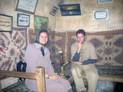 Smoking a water pipe in Si-o-se Pol bridge's teahouse; Isfahan