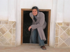 Becky peeking out of small portal, Khan-e Tabatabei, 1834 mansion of wealthy merchant