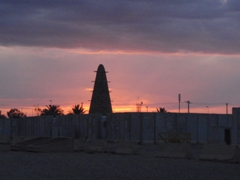 Sunset over Dodge City North, with the bat cove silhouetted; Camp Victory