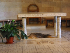 The oft-photographed floor mosaic showing fish and loaves of bread where Jesus supposedly laid down five loaves and two fishes that multiplied to feed a crowd of 5000 faithful listeners; Tabgha