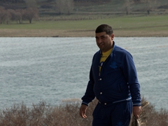 Man about to perform a chicken sacrifice at Hayravank Monastery