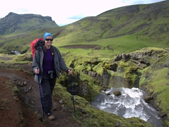 Despite the heavy pack, Becky smiles on the long hike to Thórsmörk. The first third of the hike skirts dozens of waterfalls, and the surrounding scenery is spectacular
