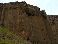 The waterfall of Litlanesfoss is beautifully framed by basalt columns such as these