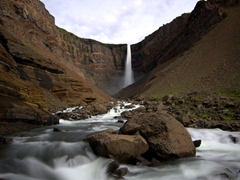 The gorgeous Hengifoss waterfall (Iceland's 3rd highest). This waterfall is unique because of the basaltic strata interspersed with red clay sandwiched between its layers