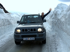 Robby stops for a wave along a snowy section of our journey to Askja