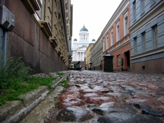 Cobblestoned streets serve pedestrians and motorists alike in old Helsinki