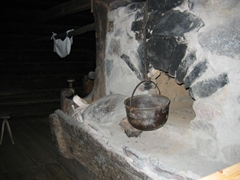 A warm fireplace where hot meals are prepared; Seurasaari Open Air Museum
