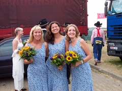 Gabi, Becky and Maria strike a bridesmaid pose at Barb & Steve's Stuttgart Rodeo Wedding