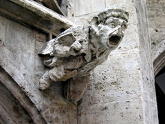A grotesque gargoyle has a wide open mouth to convey water away from this Munich Cathedral