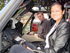 Becky and Robby get behind the cockpit of a helicopter at the 2003 Land Combat Exposition at Patrick Henry Village; Heidelberg
