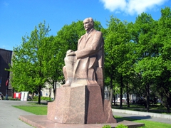 Granite statue in park next to Reval Hotel Latvija
